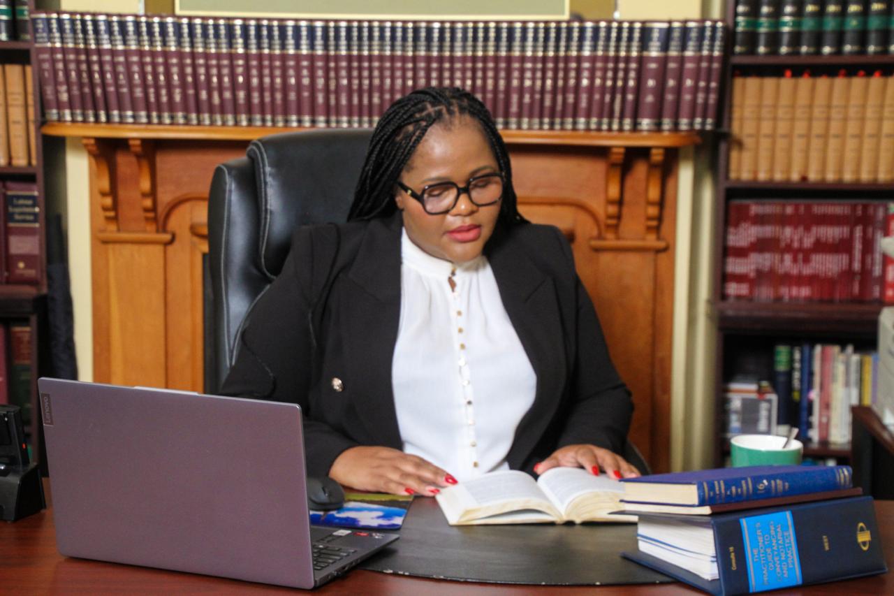Mrs Ngento reviewing a case file